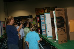 Teacher Karen Solomon of the Hebrew Academy in Tampa, leads a group of students through exhibits at the Hillsborough Regional STEM Fair last week. The academy didn't enter this year, but Solomon said the school hoped to next year. "With so few students, it's costly,'' she said. 