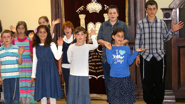 Students at the Hebrew Academy of Tampa Bay rehearse for their final performance of the school year. The Jewish day school is among a growing number that are turning to public aid for support.