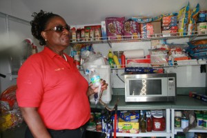 Kat Crowell-Grate relies on faith and ingenuity to make ends meet at her Kingdom Christian Academy. Here, she shows off the kitchen she and her husband built in a shed behind the school. 