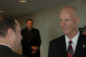 Gov. Scott chats with one of the attendees during the Catholic school event in the Capitol.