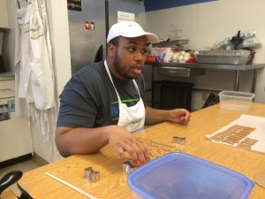 London Hurley works on Barkin' Biscuits, one of the in-house enterprises at the North Florida School for Special Education.