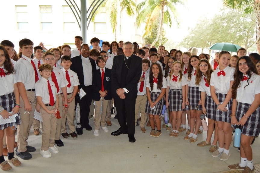 Bishop Barbarito and students